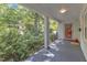 Covered front porch with painted columns and view of the front yard at 821 Onslow St, Durham, NC 27705