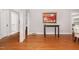 Spacious hallway with hardwood floors, white trim, and ample natural light at 821 Onslow St, Durham, NC 27705