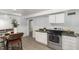 This modern kitchen features stainless steel appliances and white cabinetry at 821 Onslow St, Durham, NC 27705