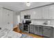 Well-equipped kitchen boasting stainless steel appliances, stylish countertops, and ample cabinet space at 821 Onslow St, Durham, NC 27705