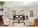 Comfortable living room with a fireplace, hardwood floors, and lots of natural light at 821 Onslow St, Durham, NC 27705