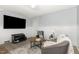 A cozy living room showcases modern decor and comfortable seating and a large-screen TV at 821 Onslow St, Durham, NC 27705
