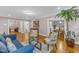 Bright and open living room with hardwood floors and access to dining room and bathroom at 821 Onslow St, Durham, NC 27705