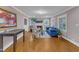 Bright living room with fireplace, large windows, hardwood floors and stylish blue couch at 821 Onslow St, Durham, NC 27705