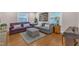Inviting living room featuring hardwood floors, stylish sofas, and a patterned rug for a cozy and chic atmosphere at 821 Onslow St, Durham, NC 27705