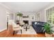 Cozy living room with a fireplace, plush seating, and a neutral color palette at 821 Onslow St, Durham, NC 27705