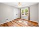 Cozy bedroom with wood floors, closet, and natural light, offering a comfortable living space at 8620 Glendale Dr, Apex, NC 27539