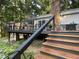 Multi-level deck features an outdoor seating area and steps leading to the backyard at 8620 Glendale Dr, Apex, NC 27539