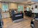 Bright, eat-in kitchen with stainless steel appliances, granite countertops, and an eat-in island at 8620 Glendale Dr, Apex, NC 27539