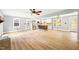 Spacious living room with an open concept design featuring a modern kitchen and abundant natural light at 8620 Glendale Dr, Apex, NC 27539