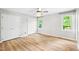 Bright main bedroom with natural light, spacious closet, and ceiling fan creating a relaxing atmosphere at 8620 Glendale Dr, Apex, NC 27539