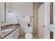 Bathroom featuring granite vanity, toilet, and a shower/tub with curtain at 924 Pebblebrook Dr, Raleigh, NC 27609