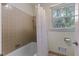 Bathroom featuring bathtub and window with natural light at 924 Pebblebrook Dr, Raleigh, NC 27609