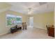Spacious bedroom with a ceiling fan, lots of natural light, and rocking chair at 924 Pebblebrook Dr, Raleigh, NC 27609