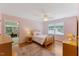 Cozy bedroom with wood floors, and an area rug at 924 Pebblebrook Dr, Raleigh, NC 27609