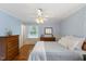 Bedroom featuring wood floors, ceiling fan, and lots of natural light at 924 Pebblebrook Dr, Raleigh, NC 27609