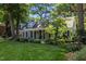 Beautiful single-Gathering home with lush landscaping, a covered front porch, and classic dormers, creating a welcoming curb appeal at 924 Pebblebrook Dr, Raleigh, NC 27609