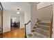 Spacious foyer with hardwood floors, staircase, and dining area view, creating a welcoming and open atmosphere at 924 Pebblebrook Dr, Raleigh, NC 27609