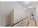 Second floor hallway featuring white railings and access to bedrooms at 924 Pebblebrook Dr, Raleigh, NC 27609