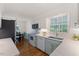 Bright kitchen with stainless appliances, modern countertops, and an adjacent breakfast nook at 924 Pebblebrook Dr, Raleigh, NC 27609