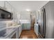 Modern kitchen with stainless steel appliances, quartz countertops, and updated cabinets at 924 Pebblebrook Dr, Raleigh, NC 27609