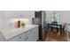 Well-equipped kitchen featuring modern appliances, sleek countertops, and a view to the breakfast area at 924 Pebblebrook Dr, Raleigh, NC 27609