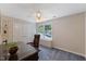 Home office featuring a large desk, comfortable chair, and plenty of natural light at 924 Pebblebrook Dr, Raleigh, NC 27609