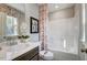 Well-lit bathroom with a tub-shower combo, stylish decor, and a modern single sink vanity at 9513 Wood River Dr, Zebulon, NC 27597
