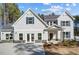 Charming two-story home with gray siding, blue shutters, and a well-manicured front yard at 9513 Wood River Dr, Zebulon, NC 27597