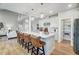 Open kitchen with island seating, pendant lighting, and a view of the Gathering room at 9513 Wood River Dr, Zebulon, NC 27597