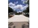 New homes featuring long concrete driveway, landscaping to be completed, under a sunny sky at 987 Lewis Rd, Zebulon, NC 27597