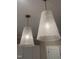 Elegant glass pendant lights with a unique cone shape and woven pattern, adding a touch of sophistication at 987 Lewis Rd, Zebulon, NC 27597