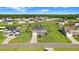 Aerial view of a neighborhood with well-maintained homes, lush green lawns, and mature trees at 104 Bollienger Dr, Princeton, NC 27569