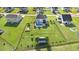 Aerial shot of a backyard featuring an in-ground pool, fenced in area, and a large grassy lawn at 104 Bollienger Dr, Princeton, NC 27569
