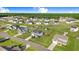 Overhead shot showcasing a neighborhood with tree-lined streets and houses with expansive lawns at 104 Bollienger Dr, Princeton, NC 27569
