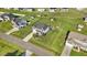Aerial view featuring a home with a spacious lawn, a fenced backyard, and a well-kept neighborhood at 104 Bollienger Dr, Princeton, NC 27569