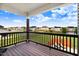 Relaxing back deck with seating and views of the fenced backyard and community at 104 Bollienger Dr, Princeton, NC 27569