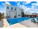 Backyard pool area with outdoor dining, lounge chairs, and privacy fence at 104 Bollienger Dr, Princeton, NC 27569