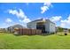 Expansive backyard with a covered porch, pool, and stone fireplace creating an inviting outdoor living space at 104 Bollienger Dr, Princeton, NC 27569