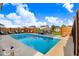 Backyard featuring a private in-ground pool, lounge chairs, a wood privacy fence, and green surroundings at 104 Bollienger Dr, Princeton, NC 27569