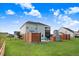 View of the beautiful backyard showcasing a pool area, stone fireplace and a wooden fence for added privacy at 104 Bollienger Dr, Princeton, NC 27569