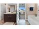 Bathroom featuring double vanity, tile floor, and separate tub at 104 Bollienger Dr, Princeton, NC 27569
