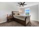 Comfortable bedroom featuring a ceiling fan, natural light, and a bed with patterned bedding at 104 Bollienger Dr, Princeton, NC 27569