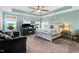 Spacious bedroom with tray ceiling, abundant natural light, and stylish decor at 104 Bollienger Dr, Princeton, NC 27569