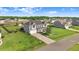 Exterior shot of a two story home featuring a manicured front yard, front-facing garage, and trimmed landscaping at 104 Bollienger Dr, Princeton, NC 27569