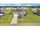 Charming two-story home with a well-manicured lawn and driveway, ideal for Gathering living at 104 Bollienger Dr, Princeton, NC 27569