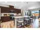 Spacious kitchen boasts large island, stainless appliances, eat-in area, and wood flooring at 104 Bollienger Dr, Princeton, NC 27569