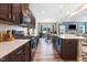 Open-concept kitchen features a large island, stainless steel appliances, and flows into living area at 104 Bollienger Dr, Princeton, NC 27569