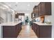 Open kitchen with stainless appliances, large island, breakfast bar and seamless access to dining area at 104 Bollienger Dr, Princeton, NC 27569