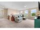 Upstairs living area featuring comfortable seating, large windows, and recessed lighting at 104 Bollienger Dr, Princeton, NC 27569